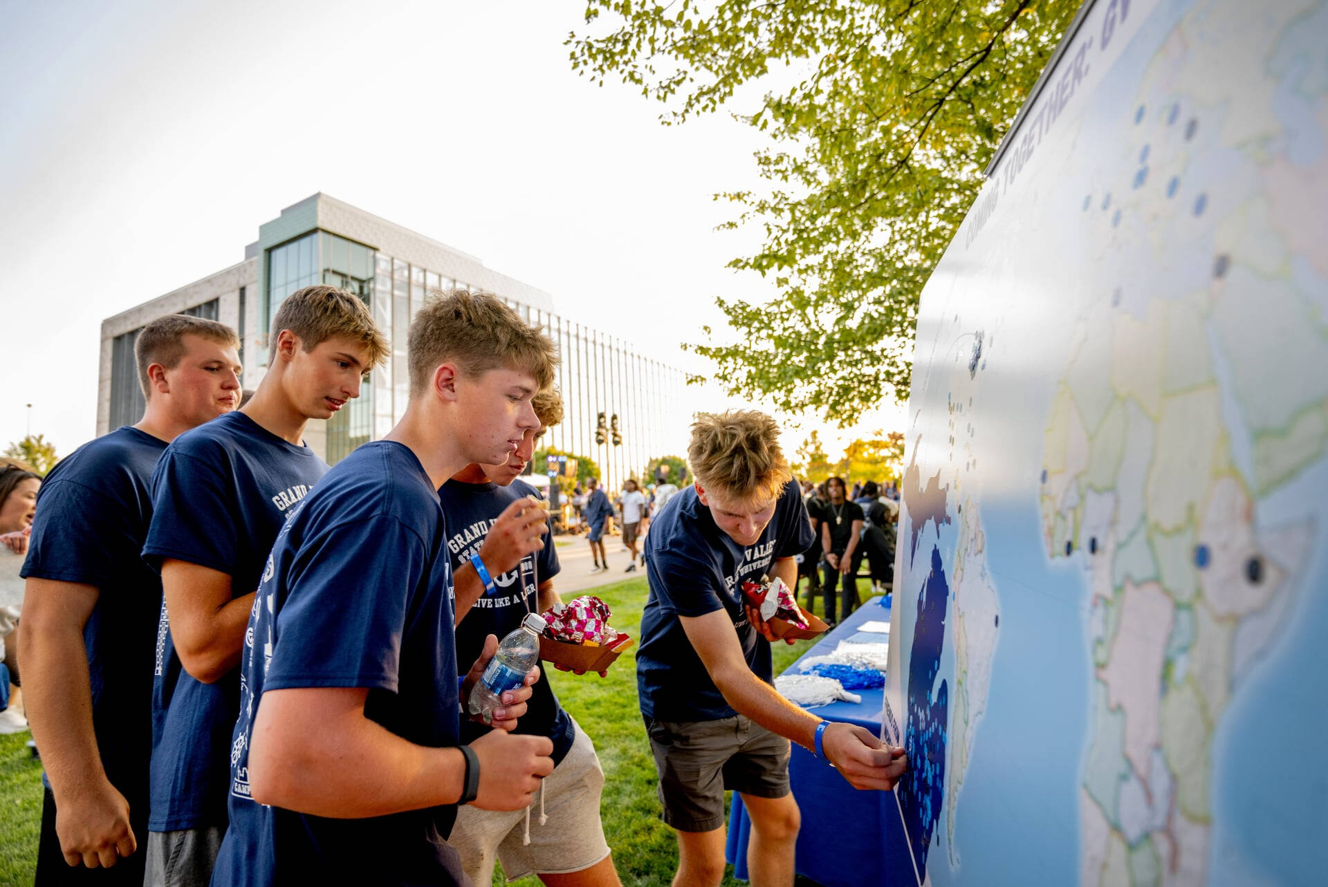 students place stickers on map to indicate their hometown